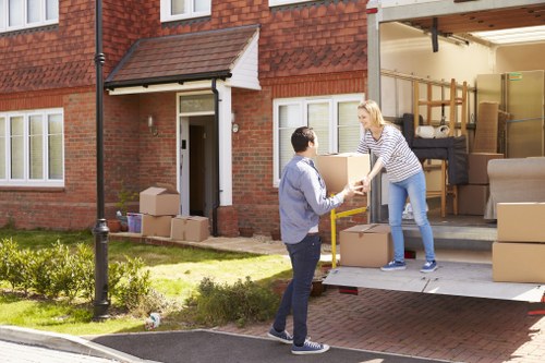 Home moving service in Kew with packed boxes and furniture ready for transport