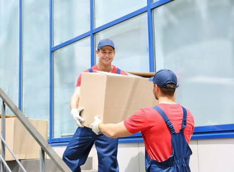 Packed office equipment ready for relocation in southwest London