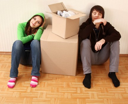 Packed and unpacked household items arranged in a Kew home