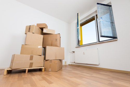 Prepared boxes and furniture ready for a moving van in Kew