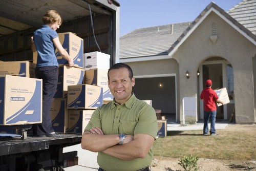 Careful handling of office items during a relocation in Kew