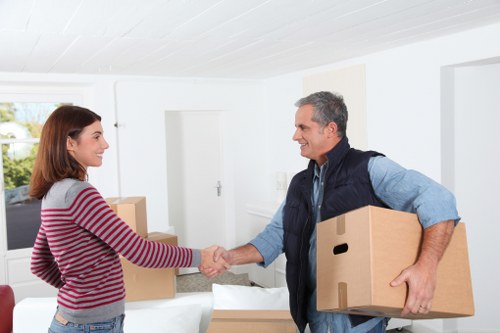 Professional movers loading furniture into a truck in Kew