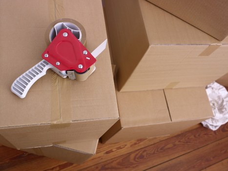 Careful loading of furniture and boxes for a home move in Kew